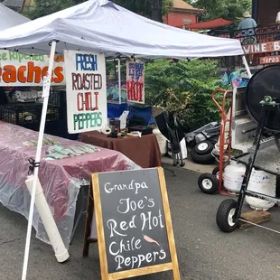 a bbq with a sign for sale