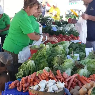 a woman buying vegetables