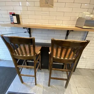 two wooden chairs facing each other