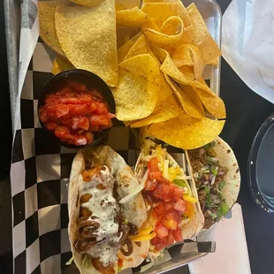 Beef, chicken &amp; fish taco with chips and salsa.