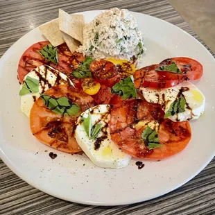 Caprese salad with homegrown heirloom tomatoes and a scoop of tuna salad a la carte