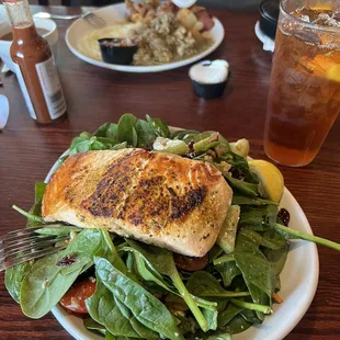 Salmon salad front, Chile Verde breakfast back