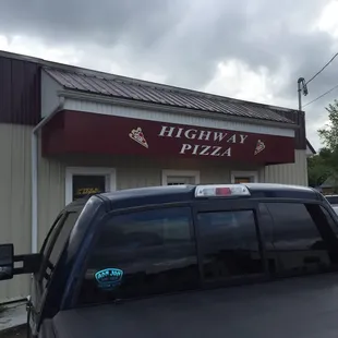 cars parked in front of it