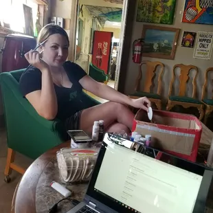 One of our local artists.  Creating and chilling in the lounge.