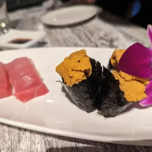 three pieces of sushi on a plate
