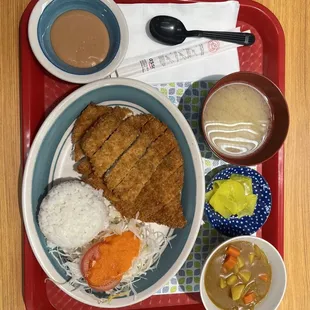 a plate of food on a tray