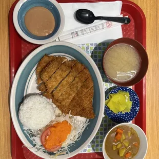 a plate of food on a tray
