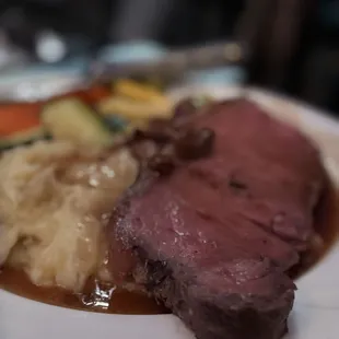 Prime rib with mashed potatoes and sauteed veggies