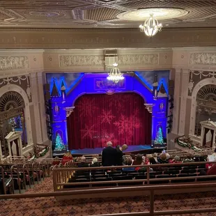 view of stage from balcony seats near the front of the balcony