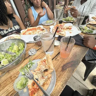 Cesar salad cheese pizza and meat lovers.