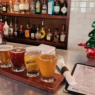a row of beer glasses on a bar