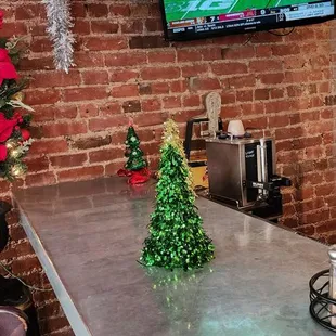 a bar with a christmas tree on the counter