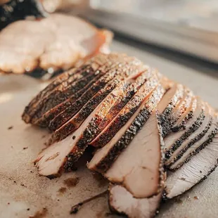 sliced pork on a cutting board