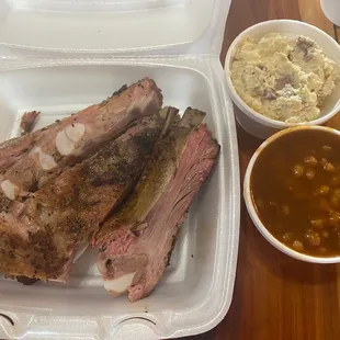 Ribs with side of potato salad and beans