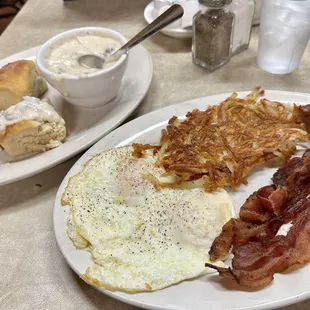 Eggs, bacon, crispy hash browns with biscuits and sausage gravy. Cost: 13.71 plus tip.