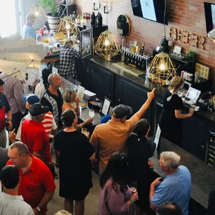 a crowd of people at the bar