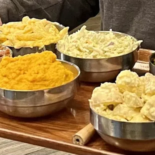 Baked Beans with Burnt Ends, Sweet Potato Bourbon Mash, potato salad, collard greens, Confetti Coleslaw and Mac &amp; Cheese