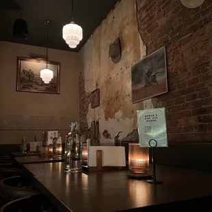 a bar with a brick wall