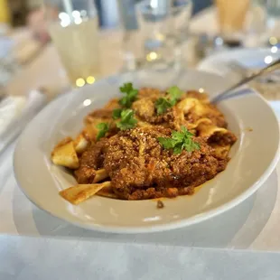 SEVEN-HOUR BOLOGNESE-pappardelle pasta, red sauce stewed with beef and pork, parmesan cheese