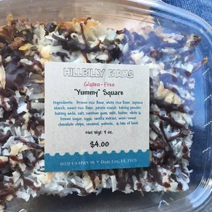 a plastic container filled with coconut squares