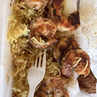 Blackened butter Cajun shrimp with seasoned rice &amp; hush puppies