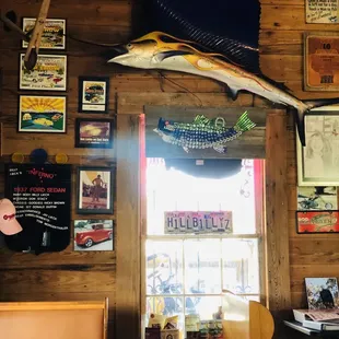 a fish mounted on the wall of a restaurant