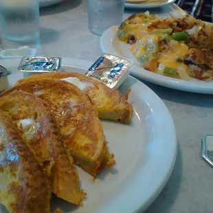Italian bread French toast dipped in real egg you can taste with potatoes smothered in sharp cheddar cheese