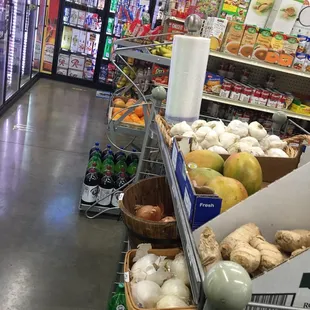 a grocery store aisle with produce