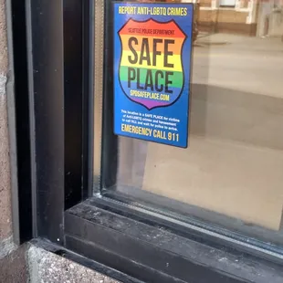 a safe place sign in a window