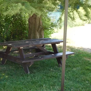 Picnic tables in rustic corners and shade.