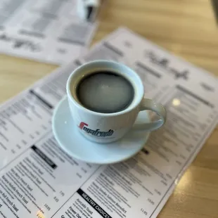 a cup of coffee on a menu