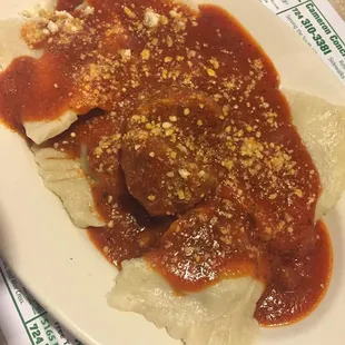 Homemade raviolis and sauce