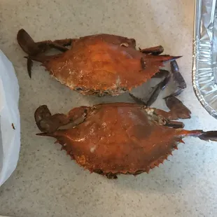 two crabs on a tray