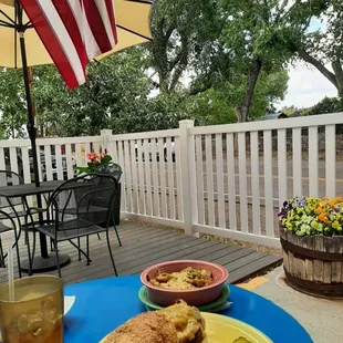 a plate of food on a patio table