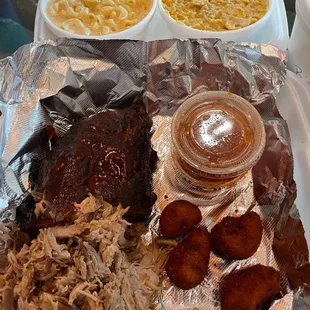 Pulled pork, ribs, Mac and cheese, creamed corn and hush puppies