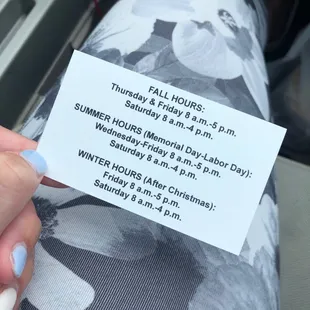 a person holding a business card