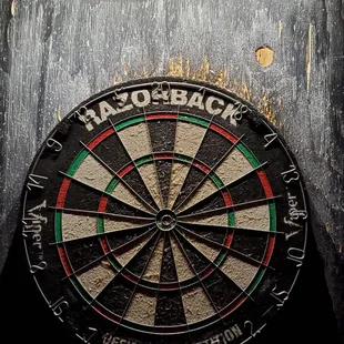 a dart in the center of a dart board