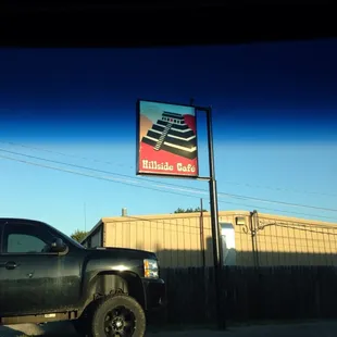a truck parked in front of a building