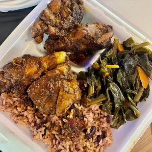 Jerk chicken with greens and rice and peas