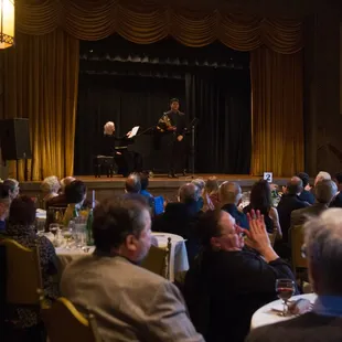Musicians playing from the stage of Hillside Club