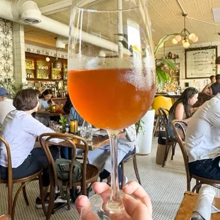 Glass of Kiki &amp; Juan orange wine