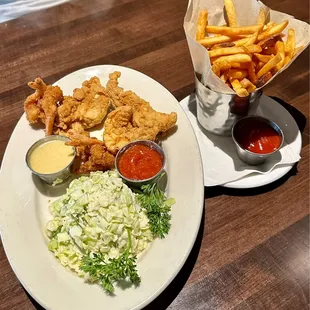 Shrimp, chicken, and coleslaw with french fries