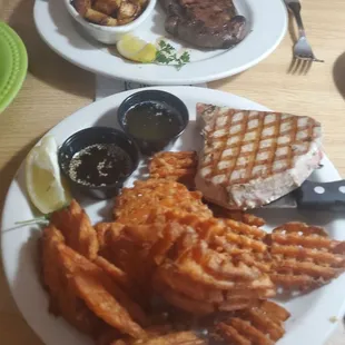 Ribeye and home fries. Tuna with sesame soy sauce and sweet potato waffle fries.