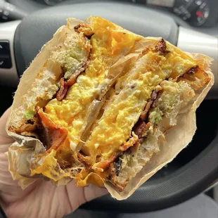 Fantastic brekky sando with soft scrambled eggs + tillamook cheddar + bacon + avocado + mayo (my pref) on good toasty sourdough