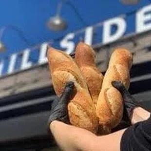 Front of store with fresh baguettes.