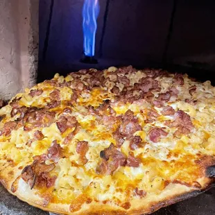 a pizza being cooked in an oven