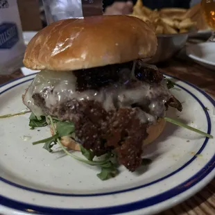 Hillside burger with pickles on the side