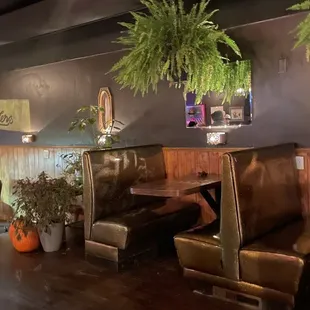 a view of a restaurant with a long table and chairs