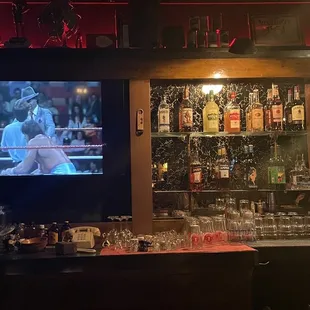 a bar with a television in the background