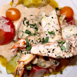 a plate of seafood and vegetables